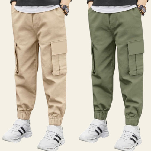 Two pairs of cargo pants, one beige and one green, worn by models on a street.