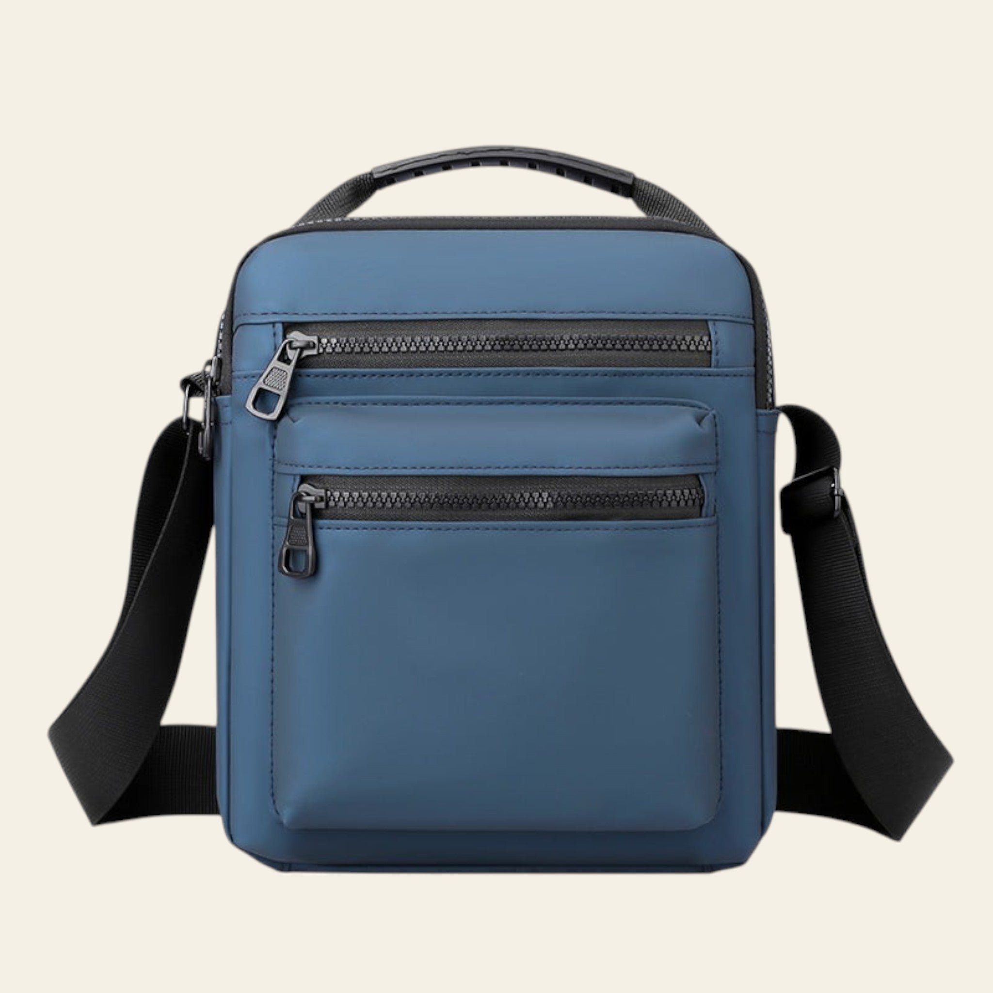 Blue crossbody bag with black straps on a white background