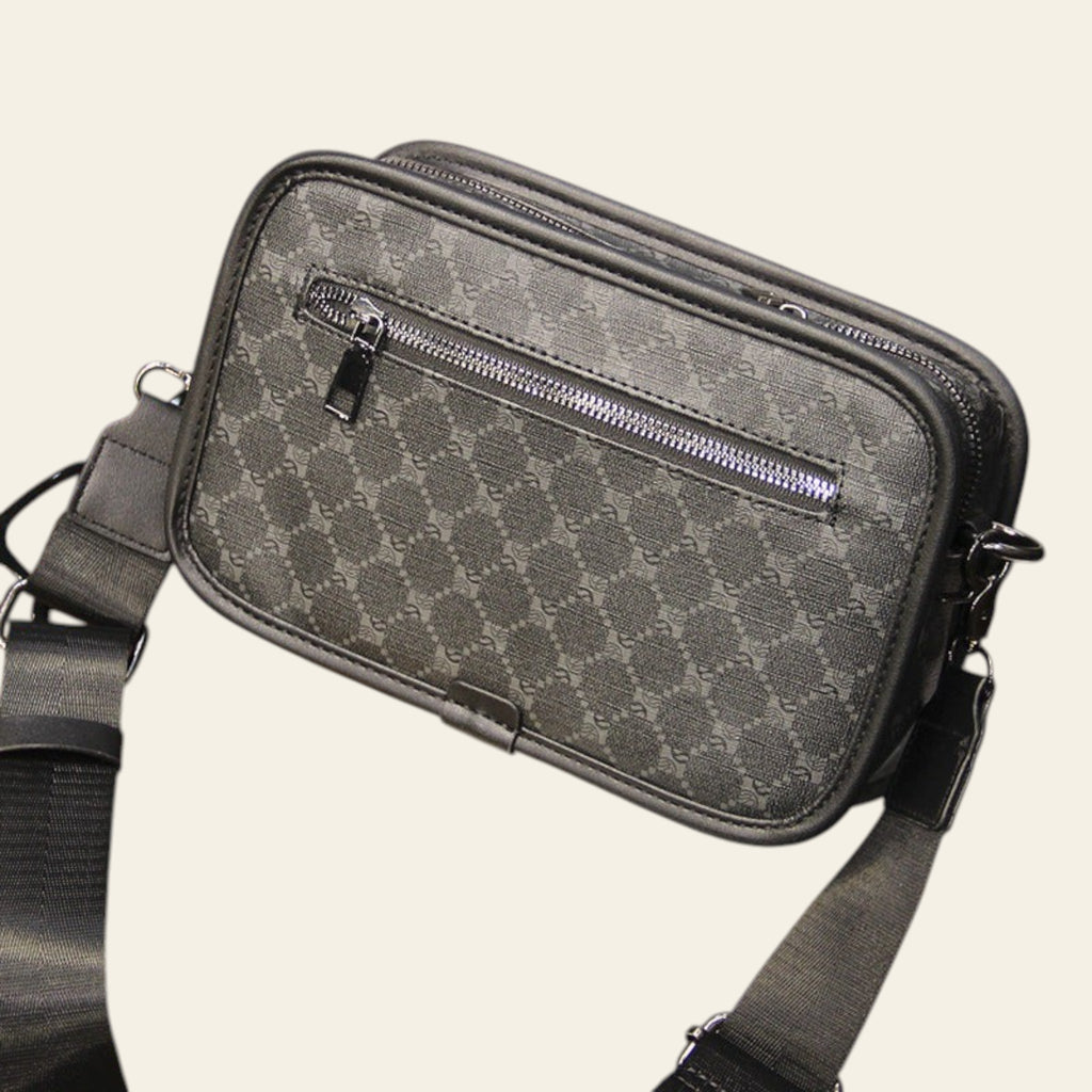 Gray patterned shoulder bag on a wooden table