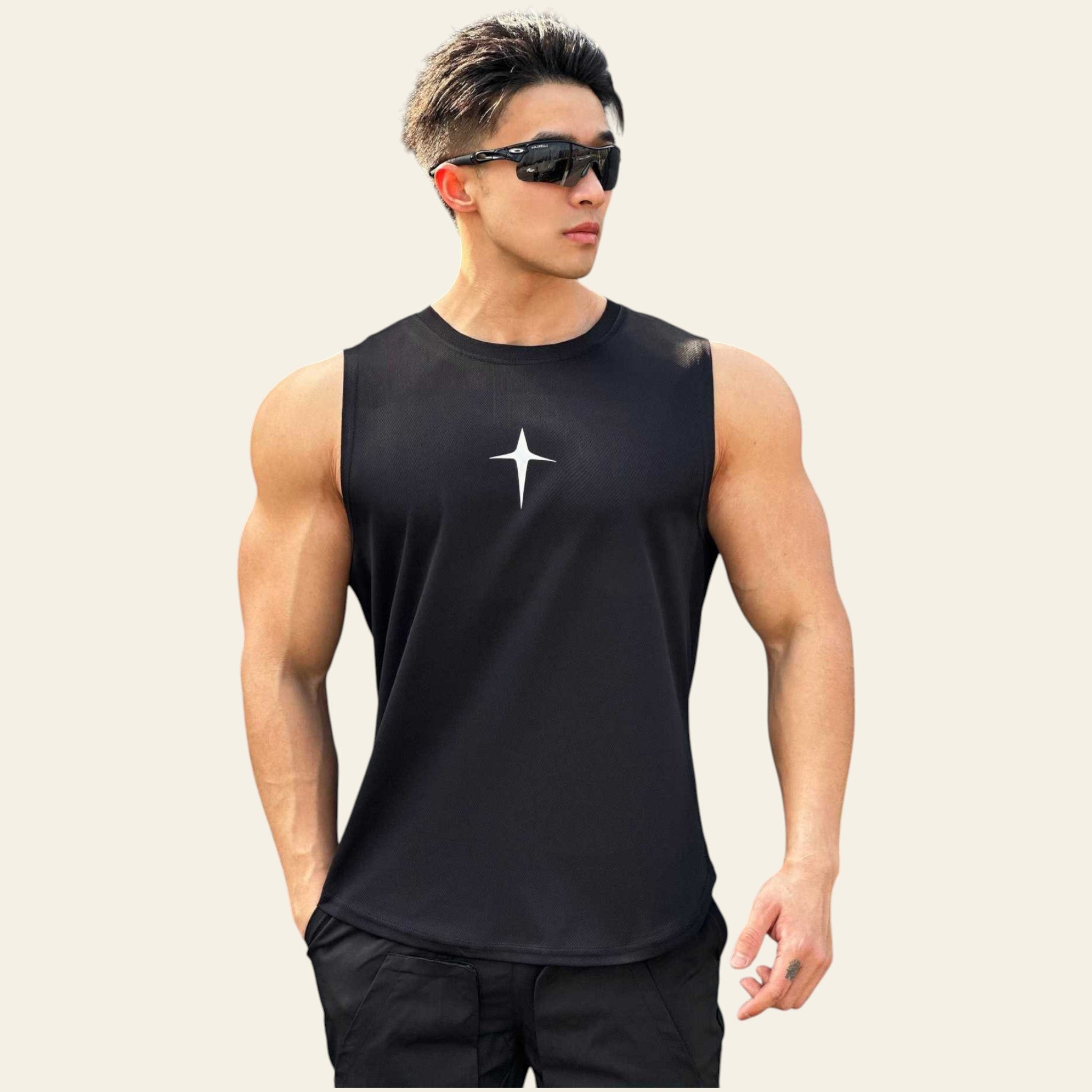 Man wearing a black  sleeveless crew neck slim-fit tank top