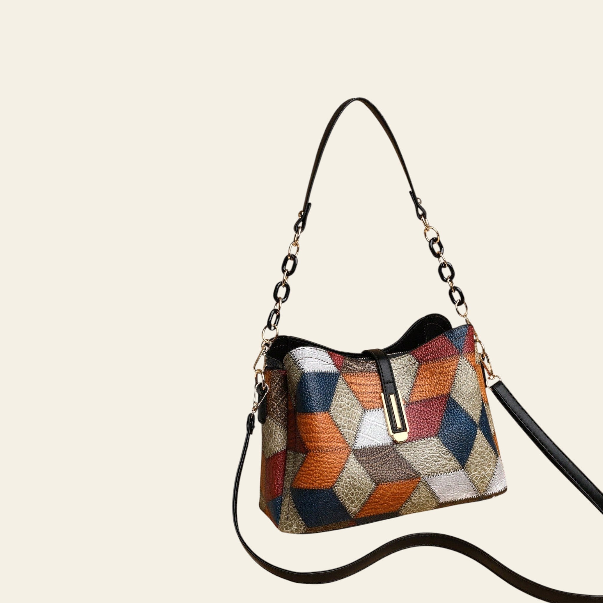 Multicolored patterned handbag with a black strap on a beige background