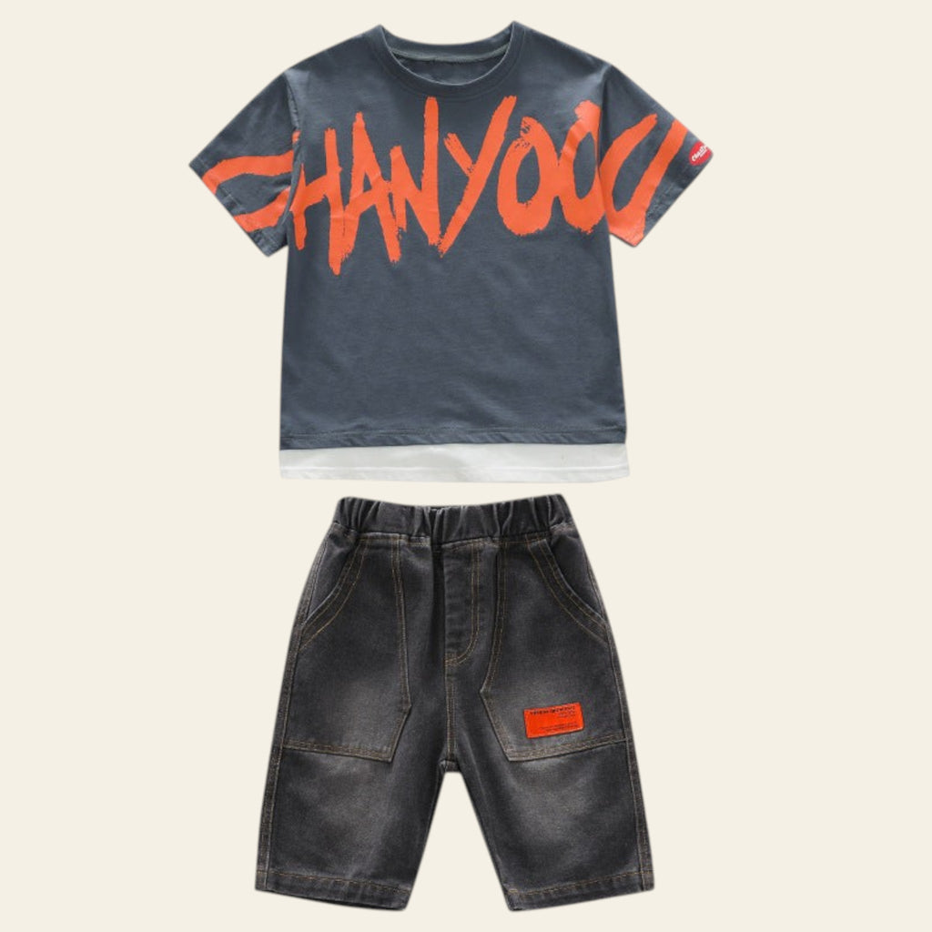 Children's outfit with gray t-shirt and shorts on a white background