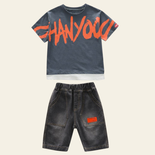 Children's outfit with gray t-shirt and shorts on a white background
