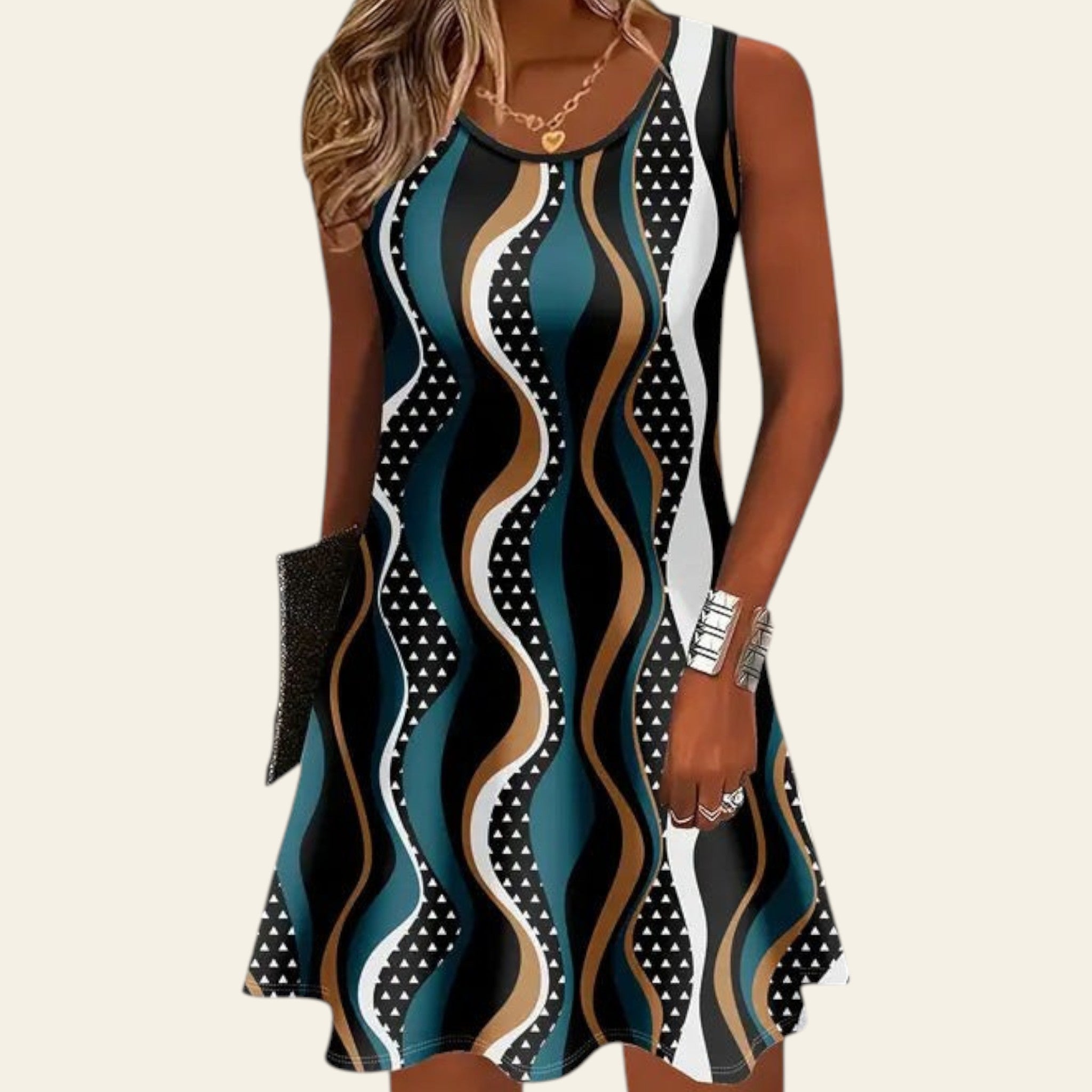 woman wearing a sleeveless dress with teal blue, black, and white geometric wave patterns