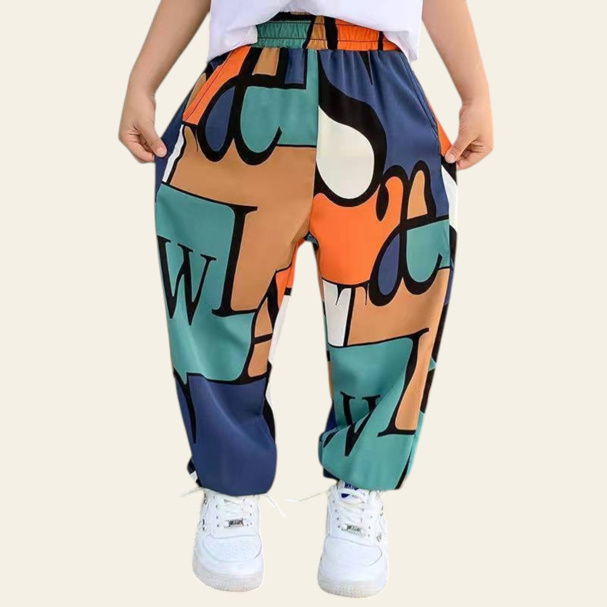 Colorful pants with abstract patterns worn by a person indoors.
