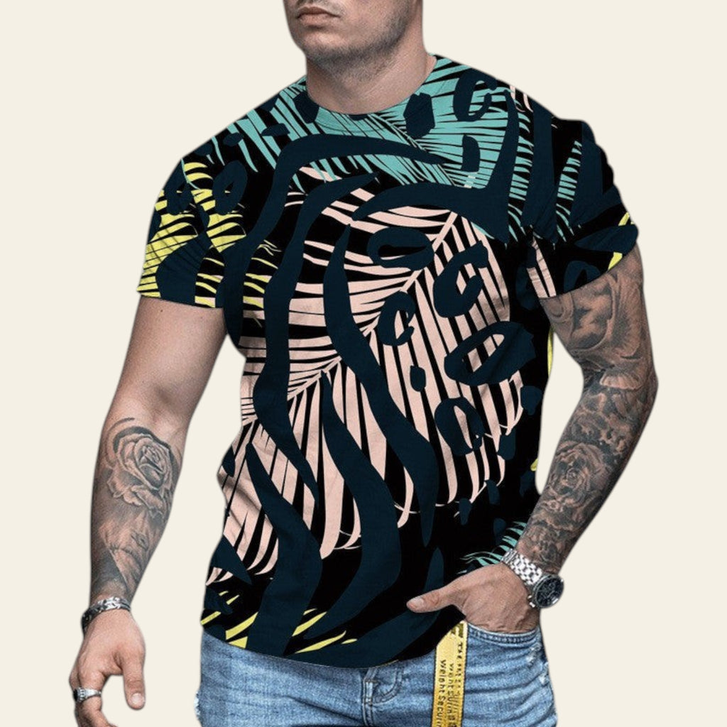 Man wearing a colorful patterned t-shirt on a blurred street background