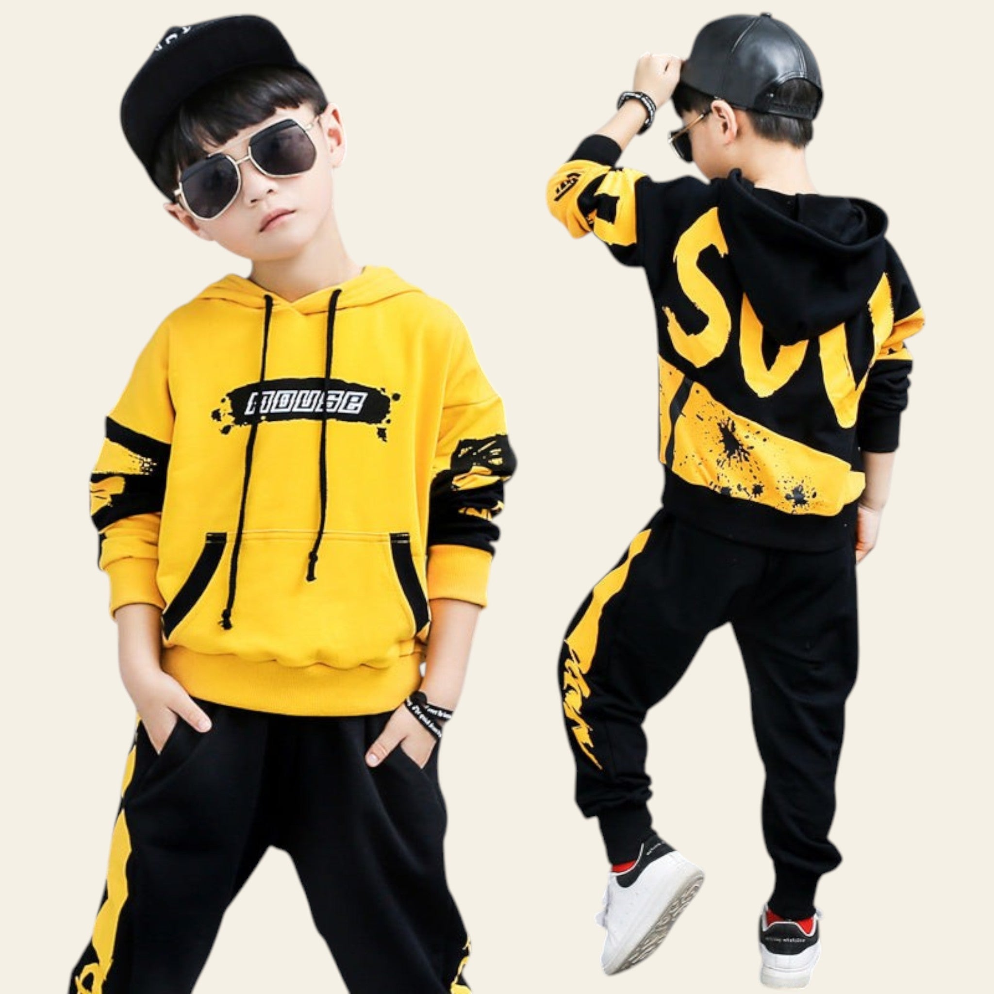 Two children wearing matching yellow and black outfits with text, posing against a gray background.