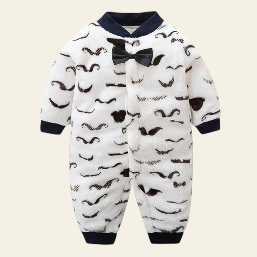 Baby onesie with mustache pattern and bow tie on a white background