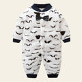 Baby onesie with mustache pattern and bow tie on a white background