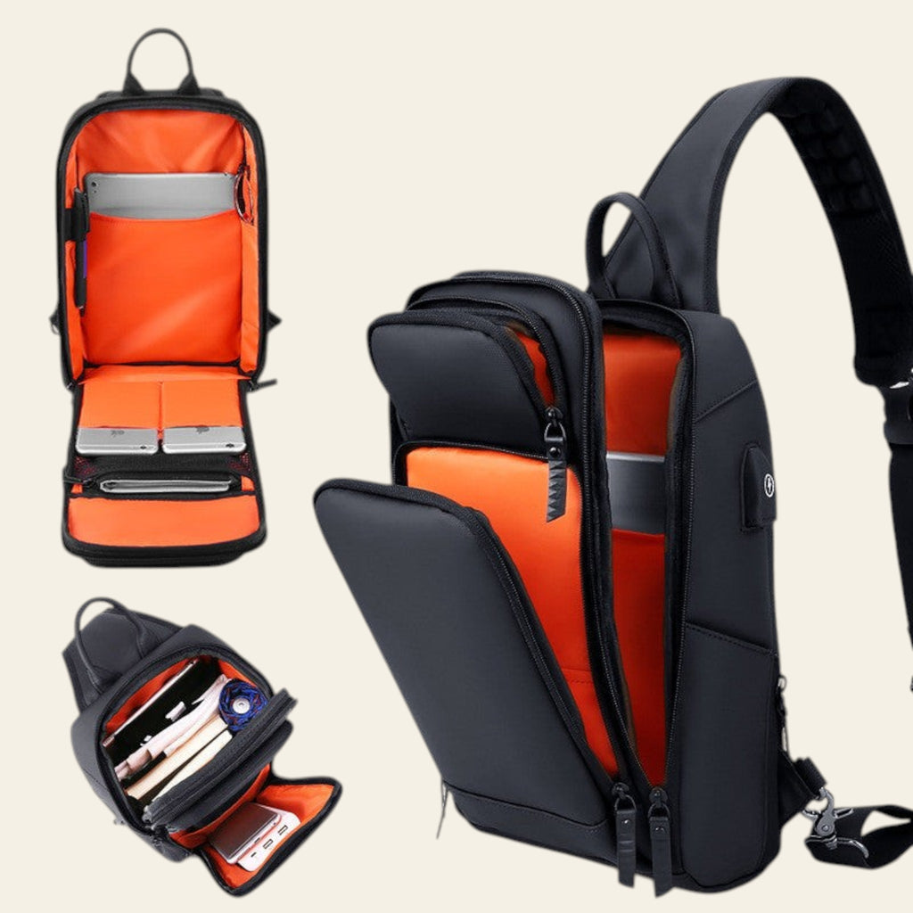 Black and orange backpack with open compartments on a light gray background