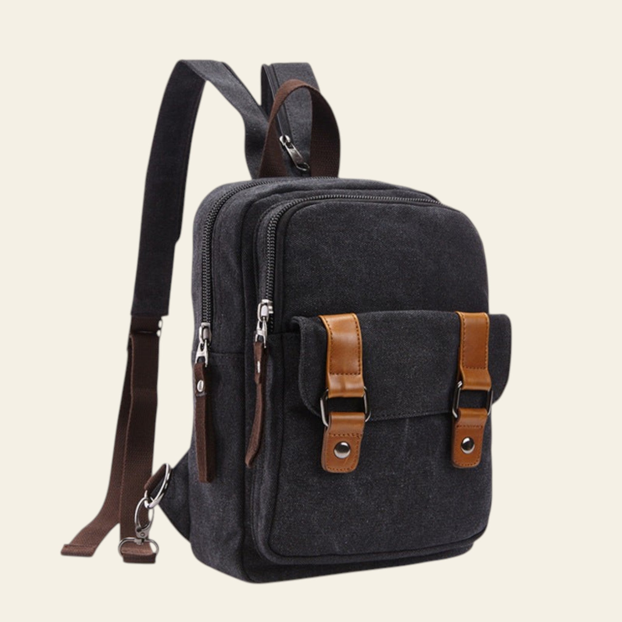 Black backpack with brown straps and accents on a white background