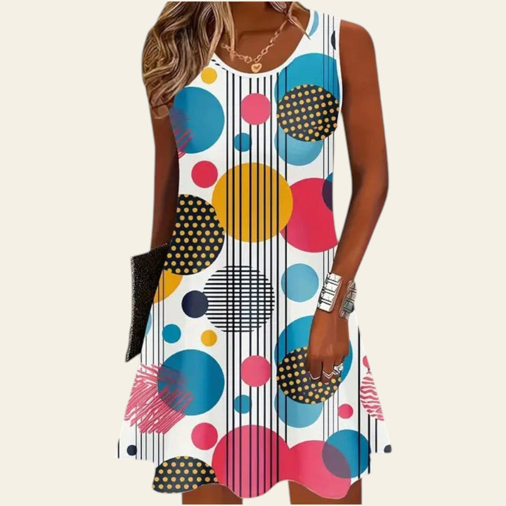 Sleeveless women's dress with colorful polka dot and geometric pattern, fitted silhouette