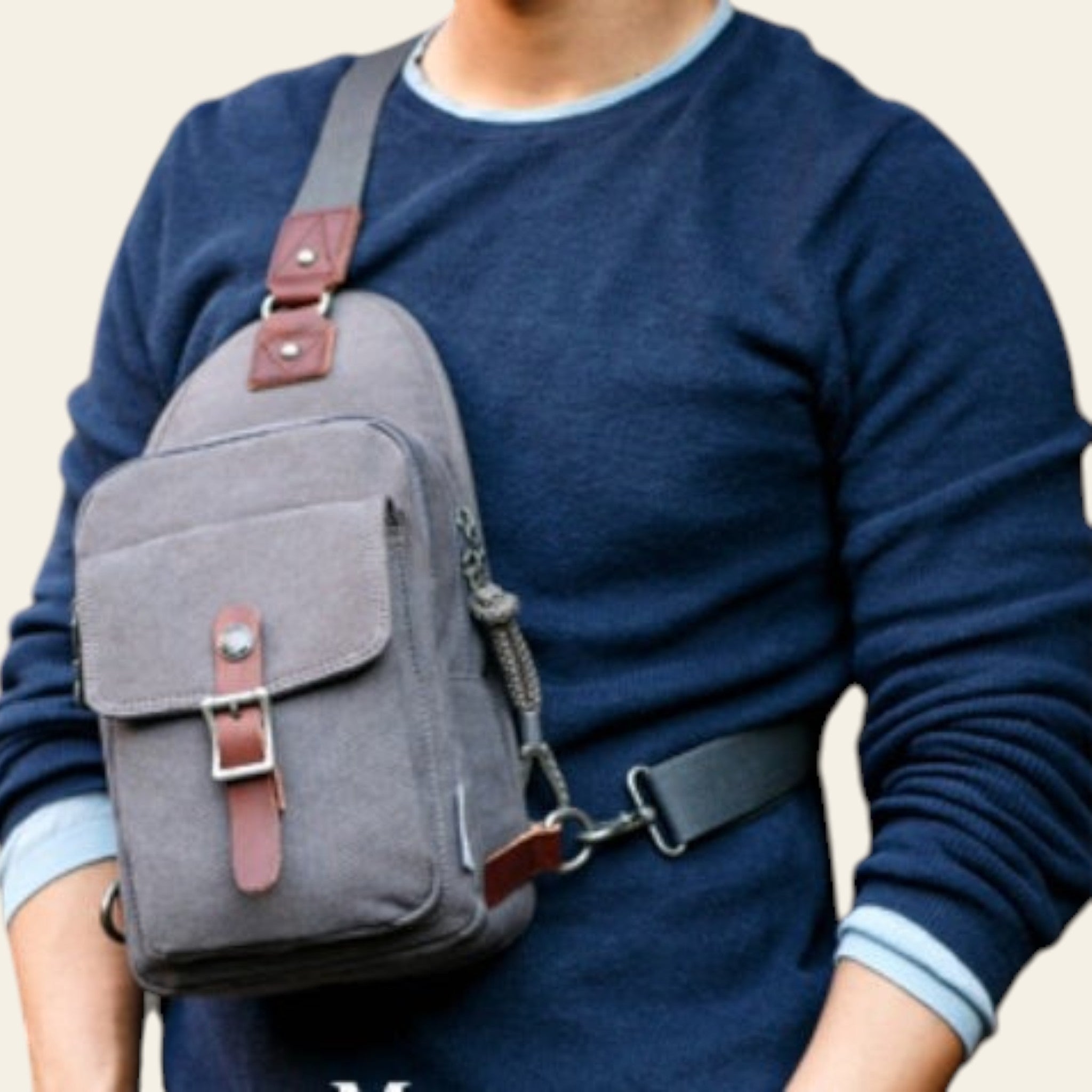 Person wearing a gray crossbody bag with brown straps