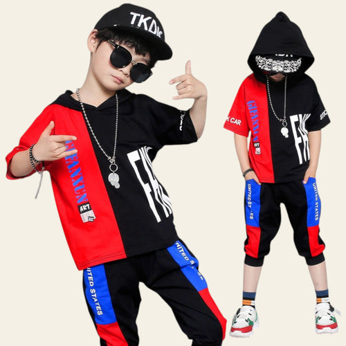 Two children wearing colorful streetwear outfits with prominent branding on a gray background.