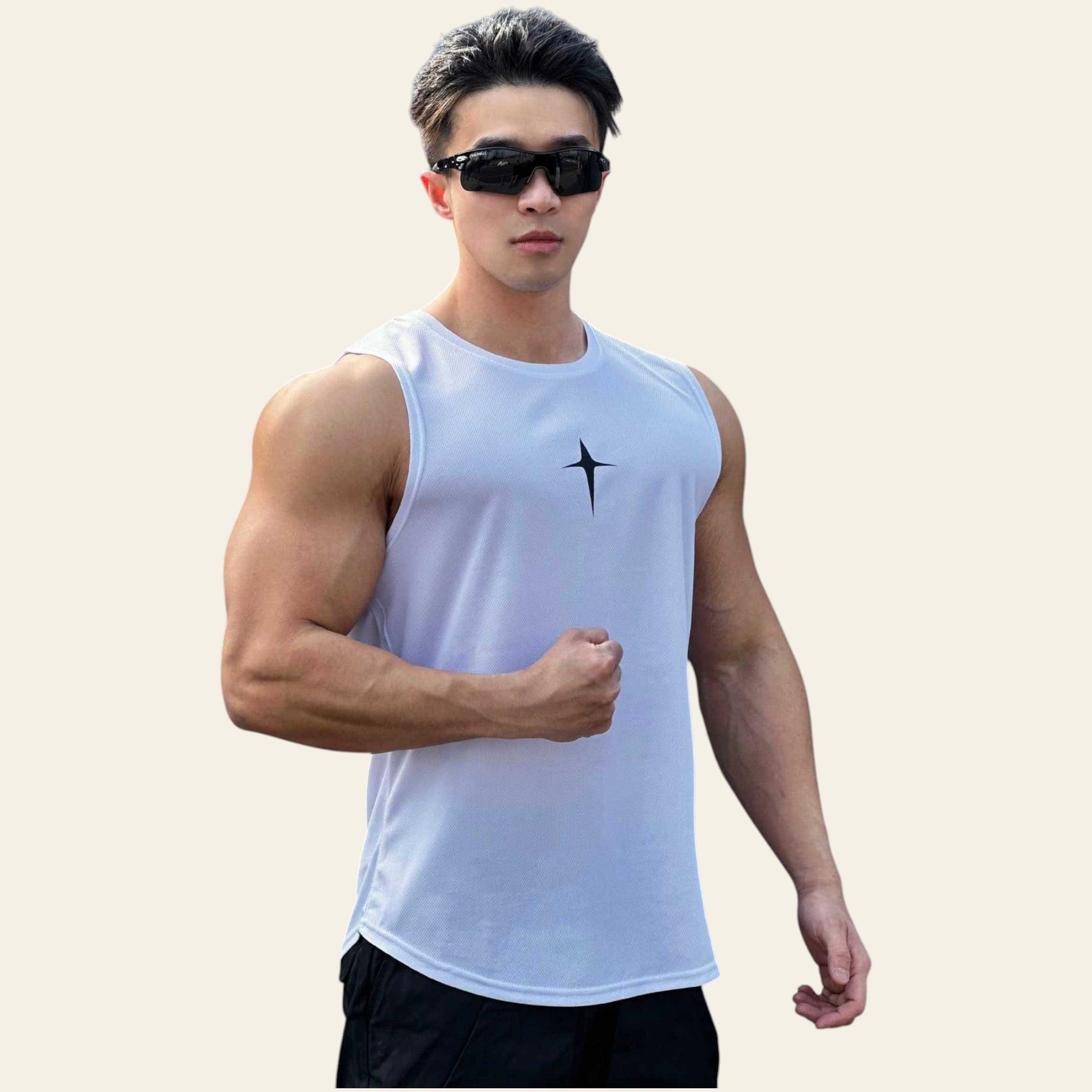 Man wearing a white sleeveless crew neck slim-fit tank top