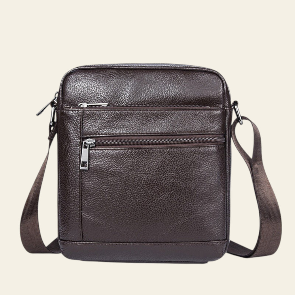 Brown leather crossbody bag on a white background