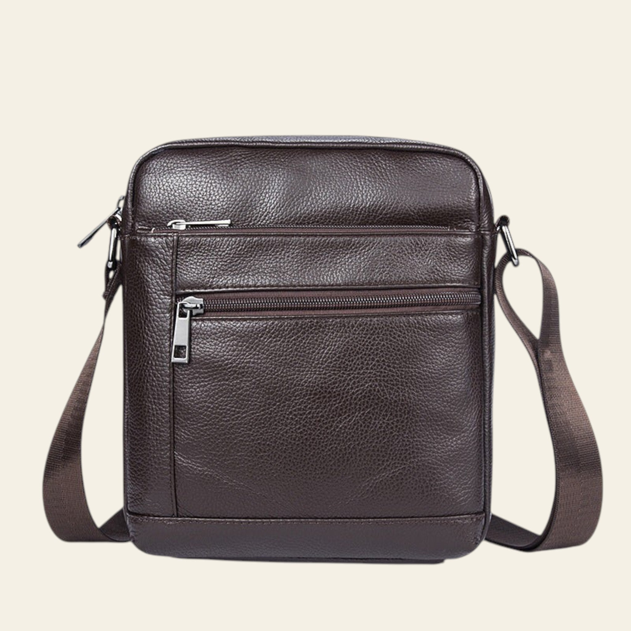 Brown leather crossbody bag on a white background