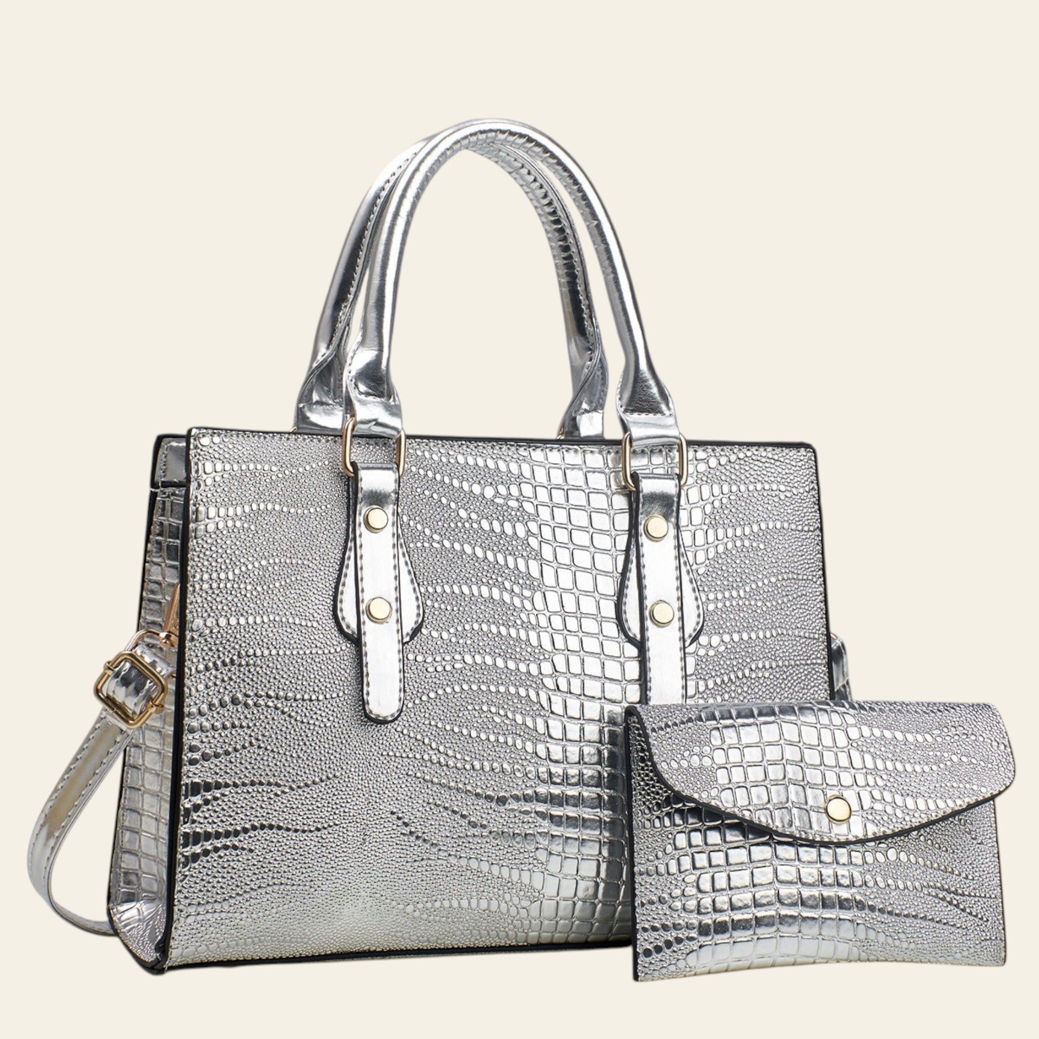 Silver textured handbag with matching wallet on a light gray background