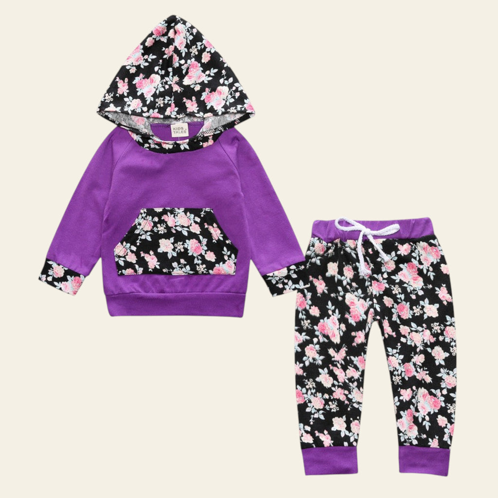 Purple hoodie and pants set with floral pattern on a white background