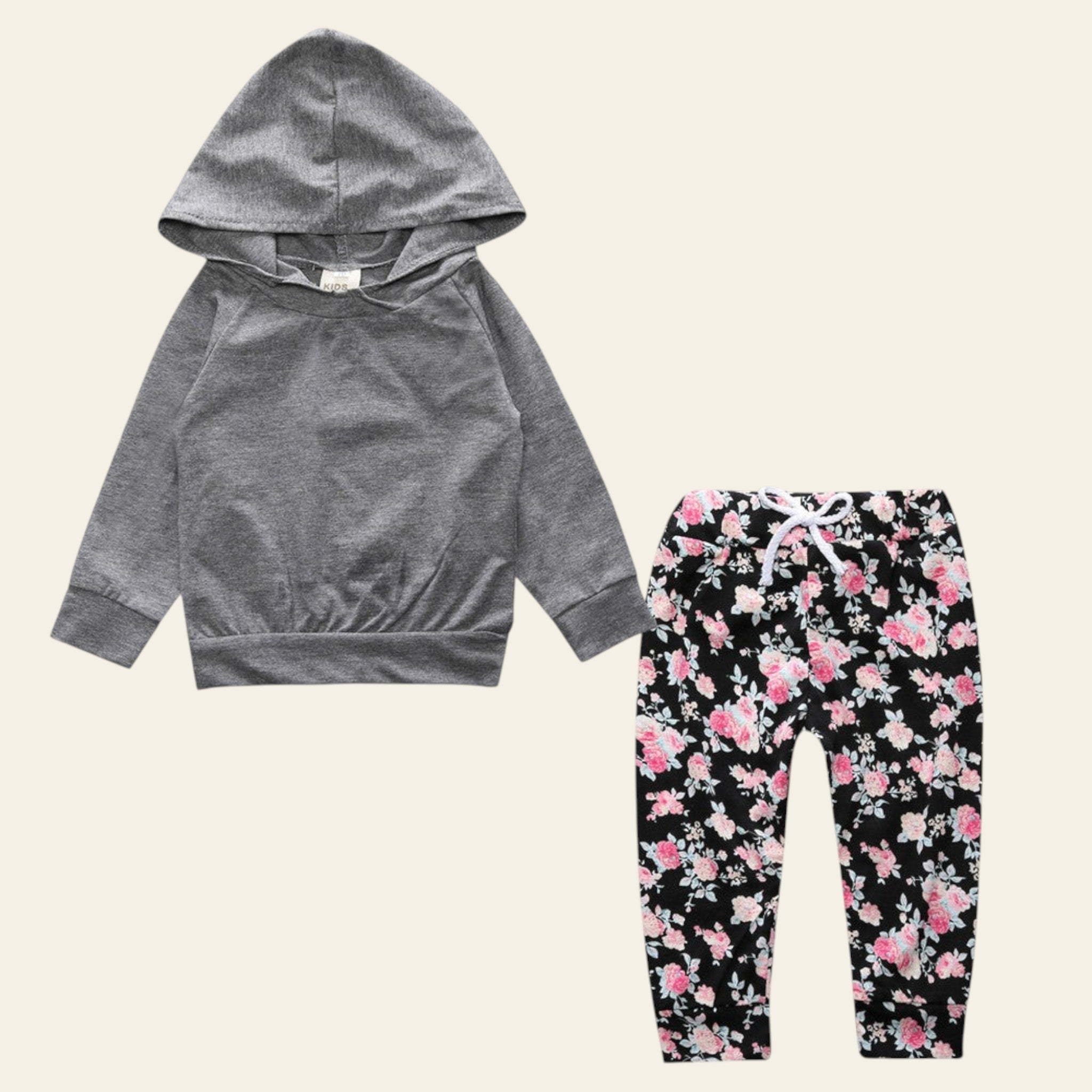 Gray hoodie and floral pants set on a white background