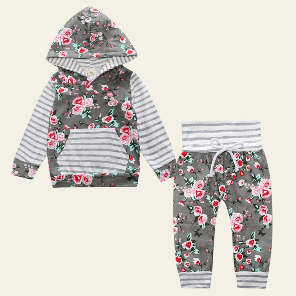 Children's hoodie and pants set with floral and striped pattern on a white background