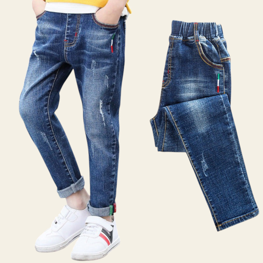 Children's blue jeans with a close-up on a white background