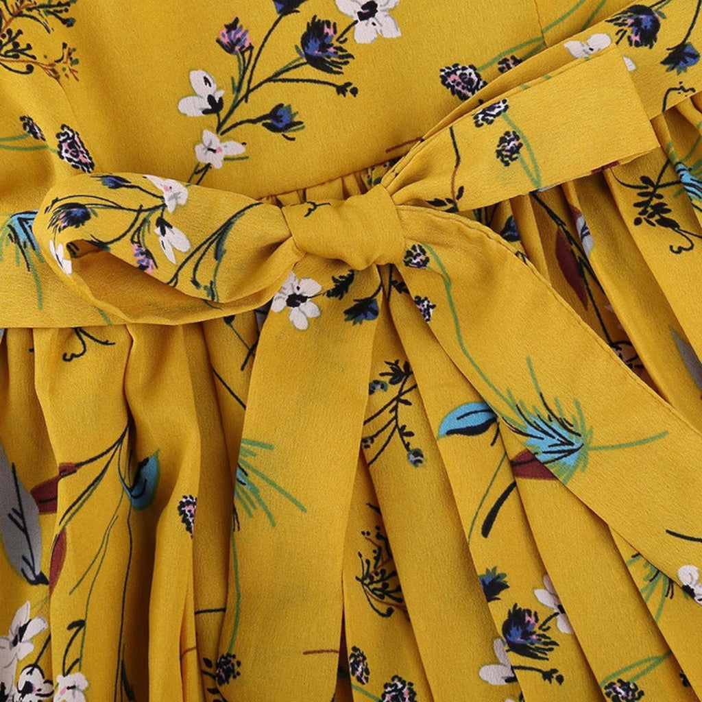 Yellow fabric with floral pattern and tied bow