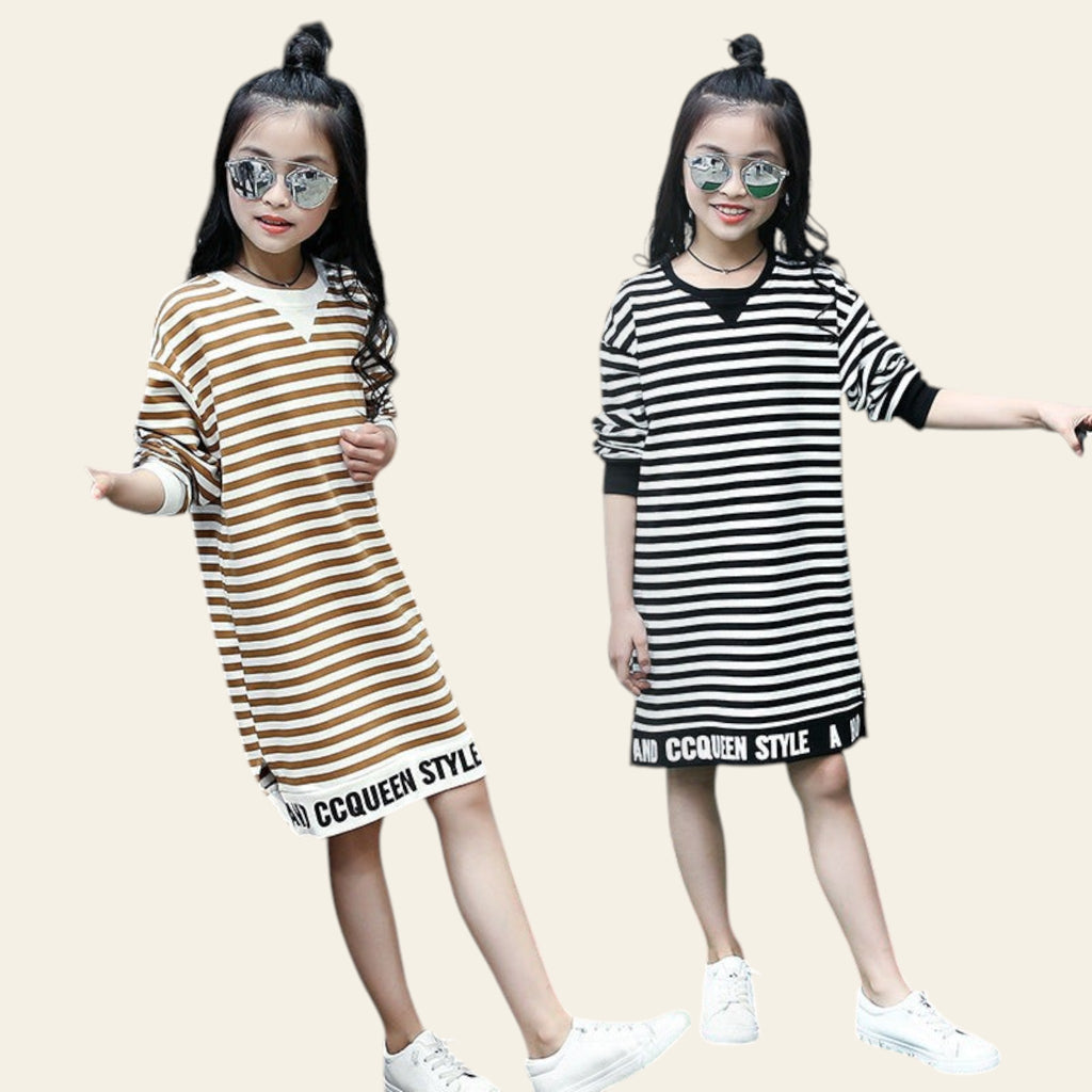 Two children wearing striped dresses with 'COCCINELLE' branding on a gray background.