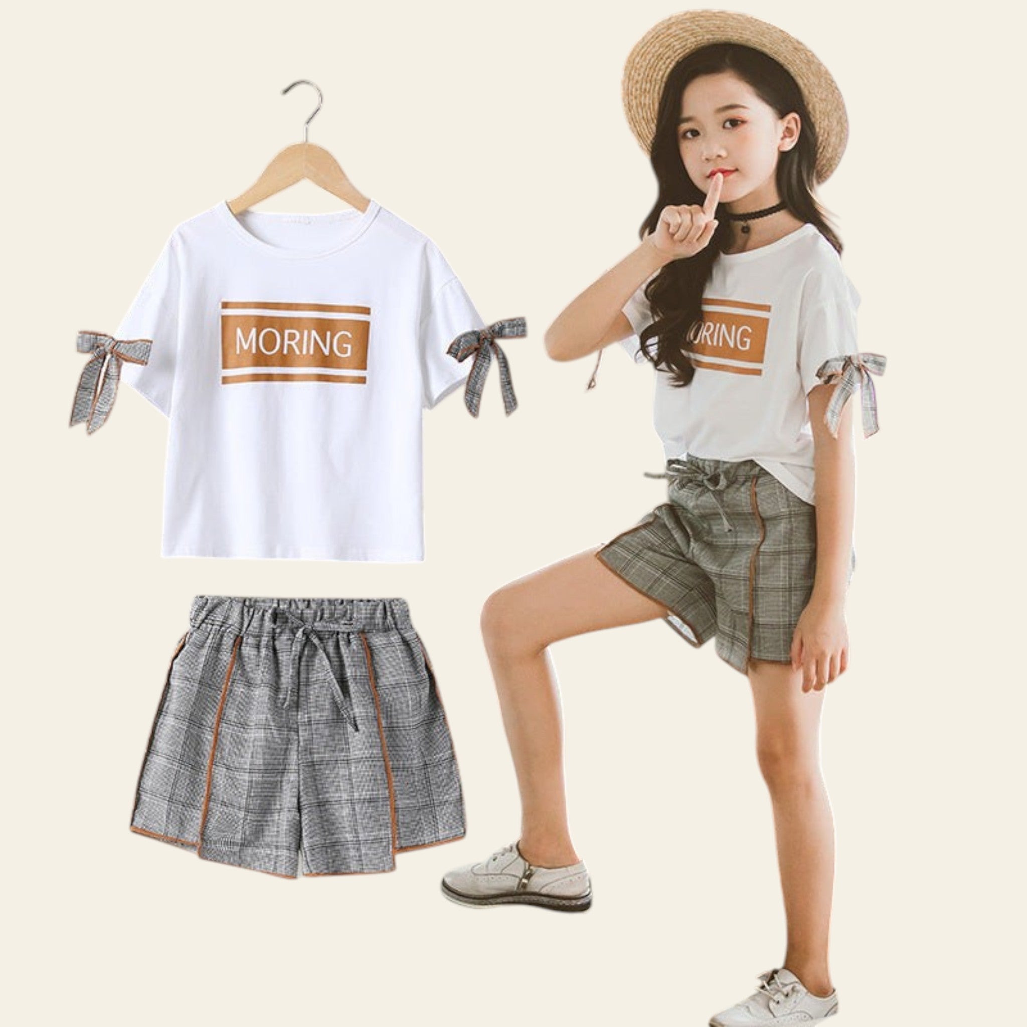 Child wearing a white t-shirt with 'MORING' text and plaid shorts, standing next to the outfit on a hanger.