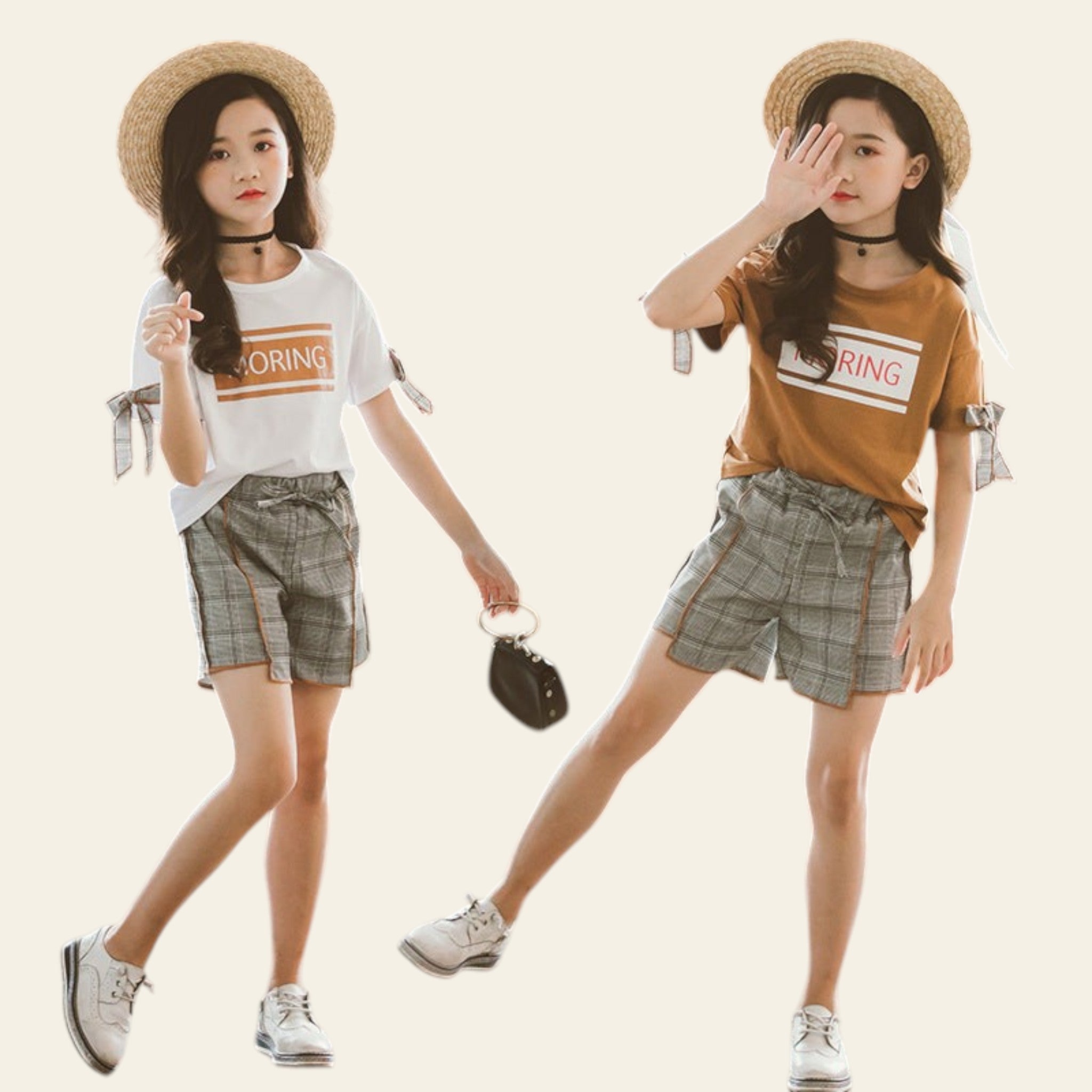 Two young women in matching outfits with hats and plaid shorts on a blurred background.