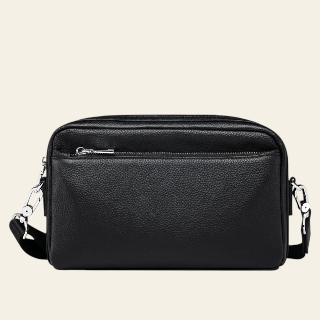 Black leather crossbody bag on a white background