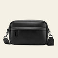 Black leather crossbody bag on a white background