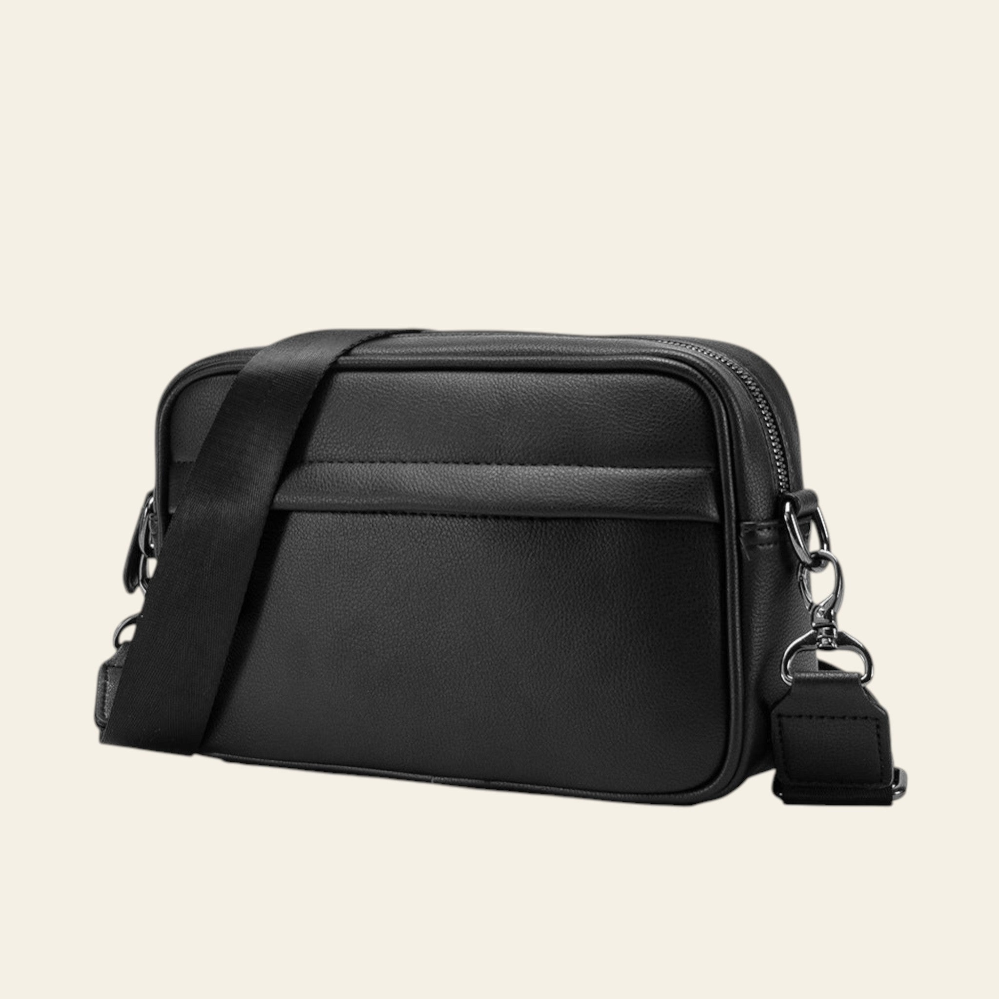 Black crossbody bag on a white background
