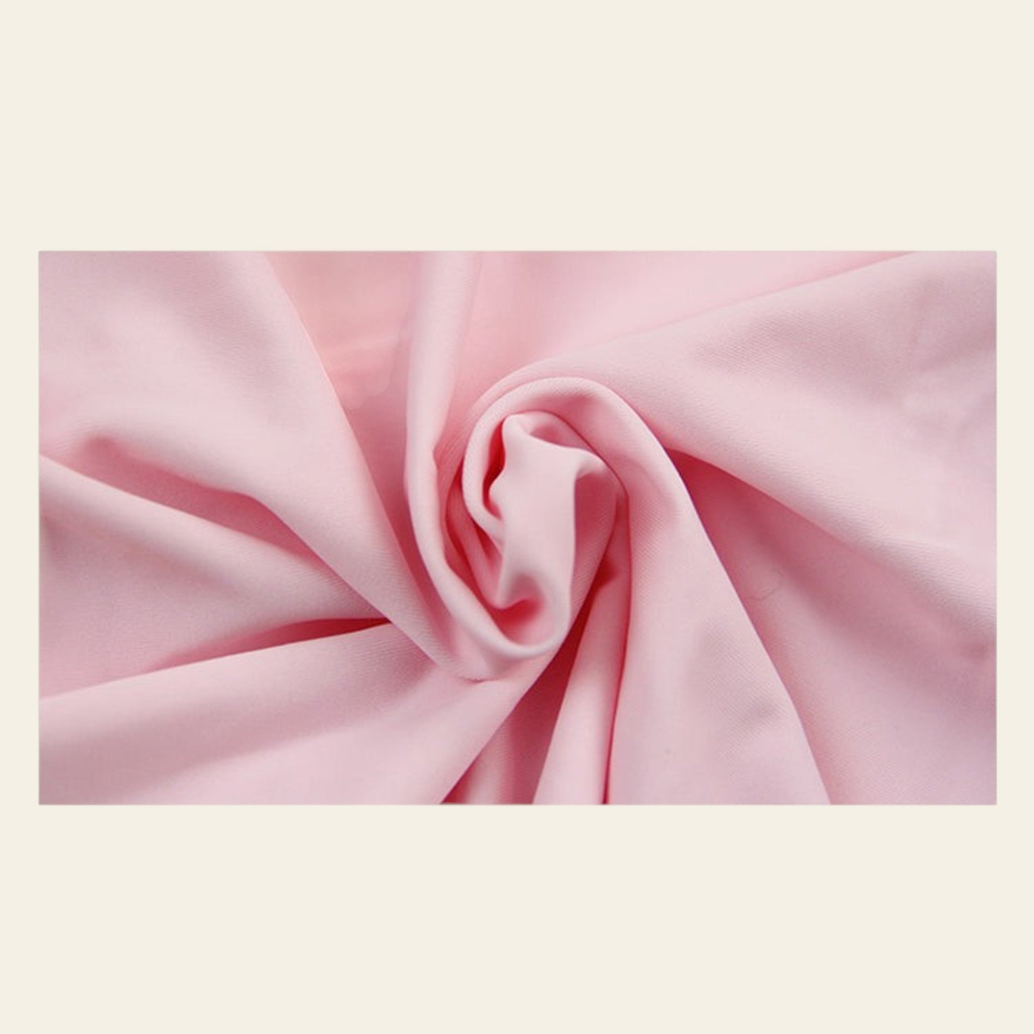 Close-up of pink fabric with folds on a white background