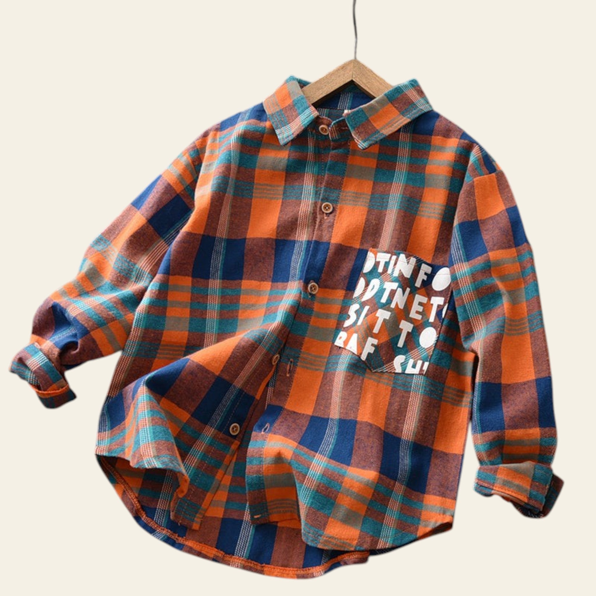 Plaid shirt with text on a wooden surface
