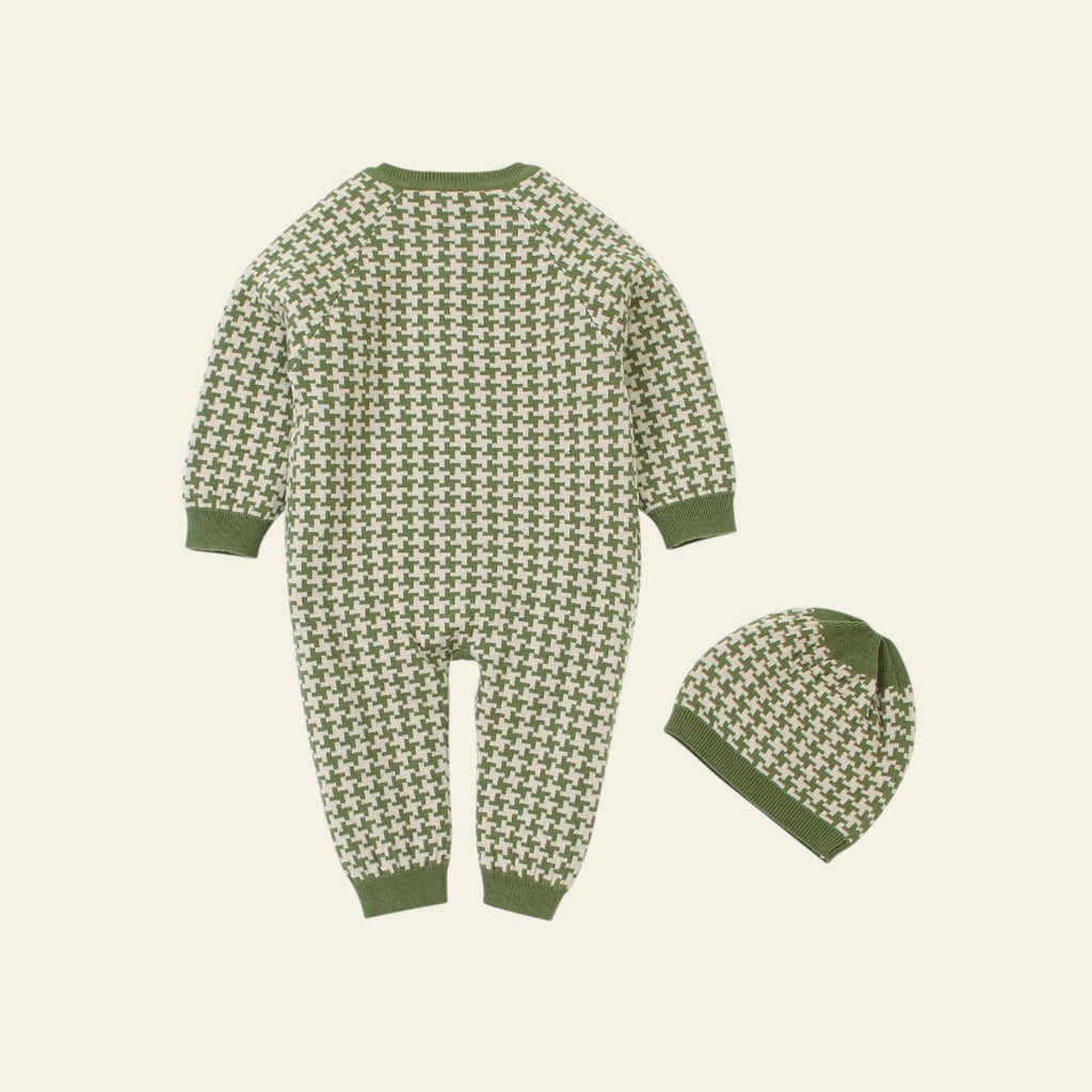 Green and white patterned baby onesie and hat set on a white background