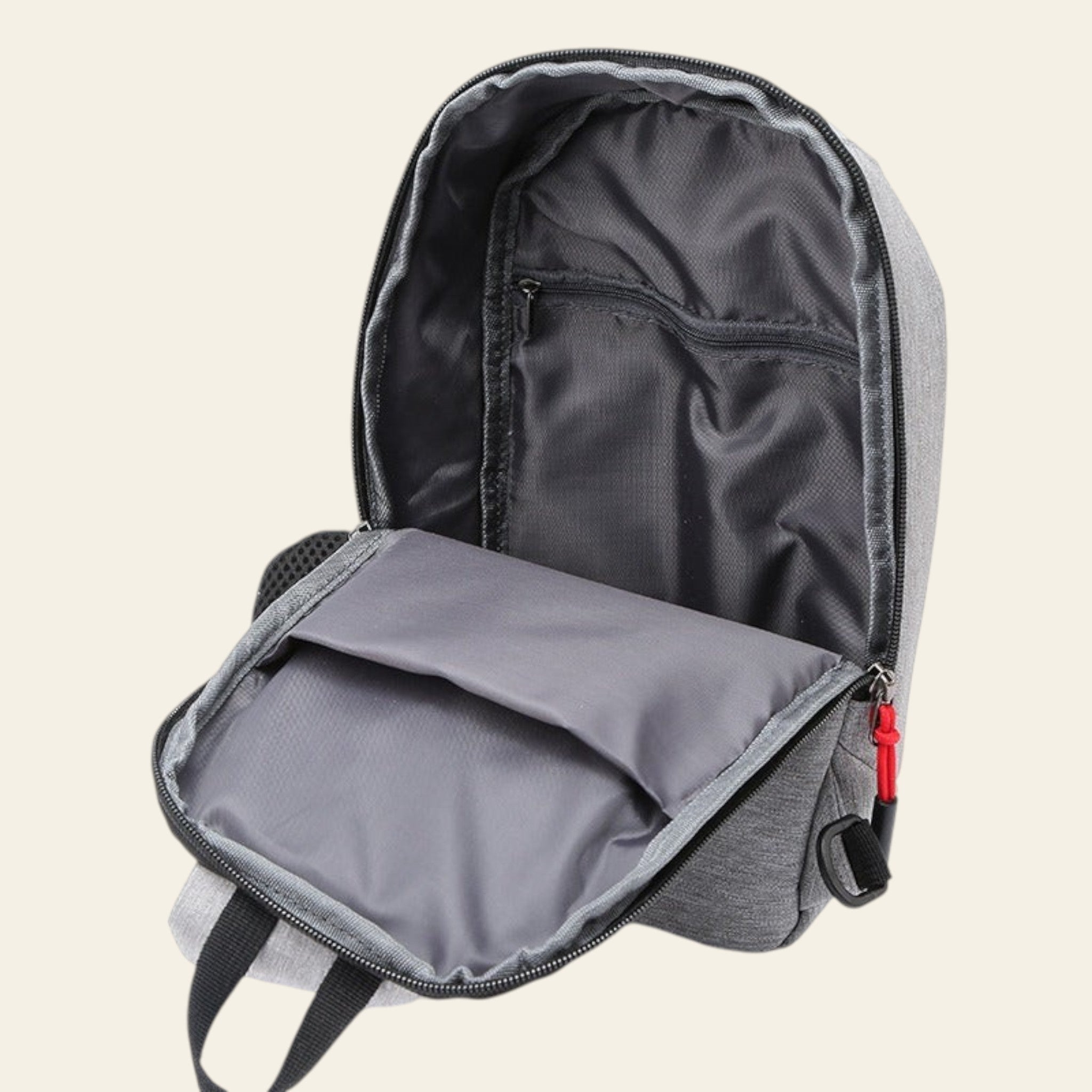 Gray backpack with open front compartment on a white background