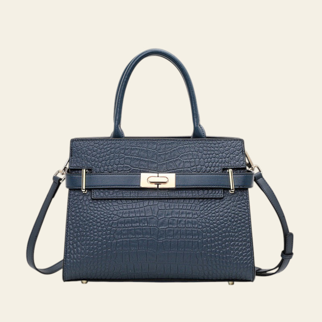 Blue textured handbag with a strap on a white background
