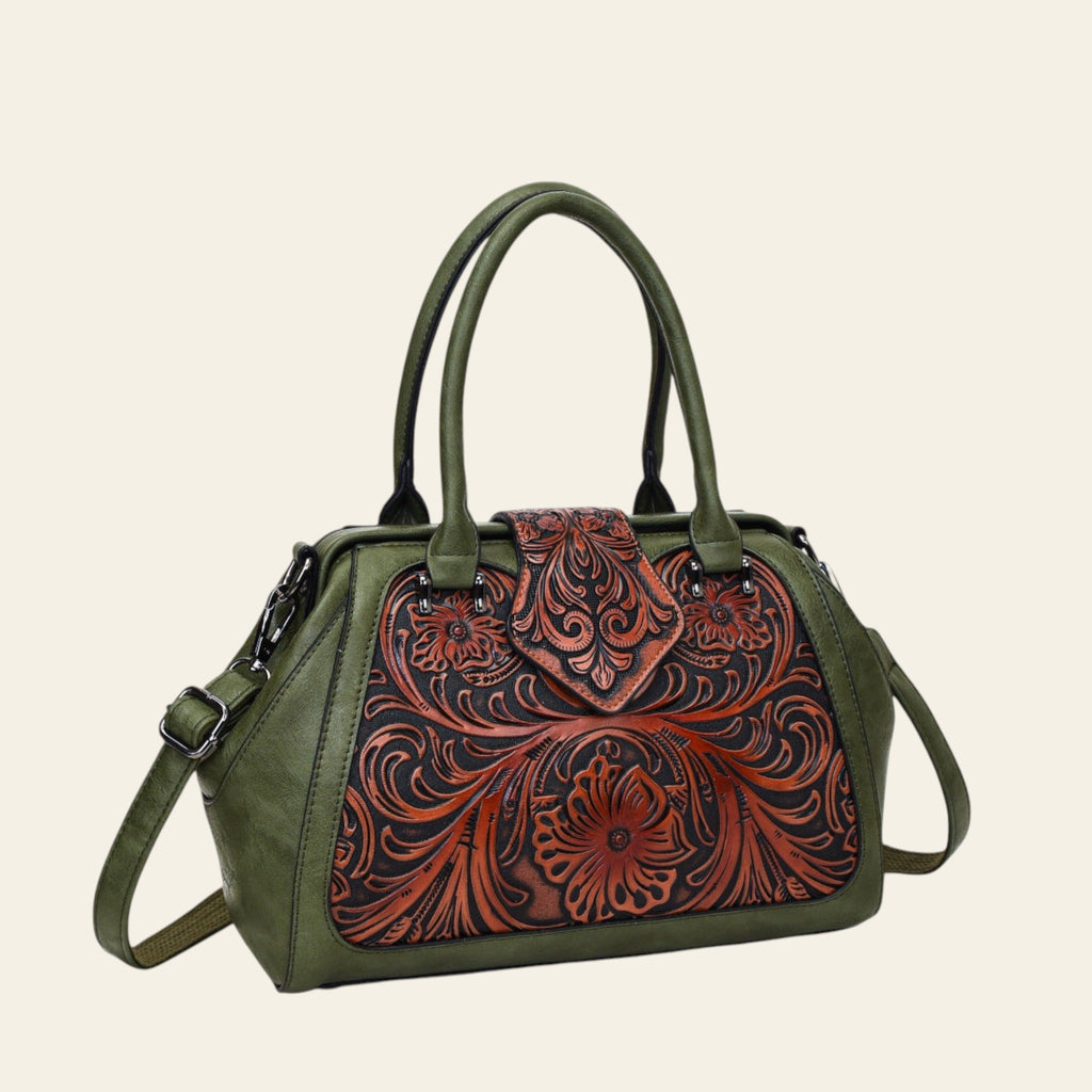 Green handbag with brown floral tooled leather design on a white background