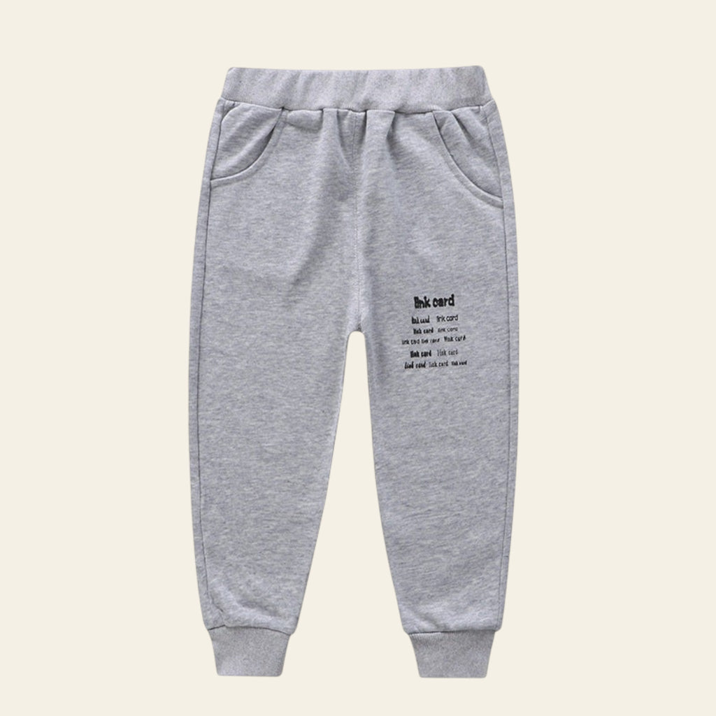 Gray sweatpants with text on a white background