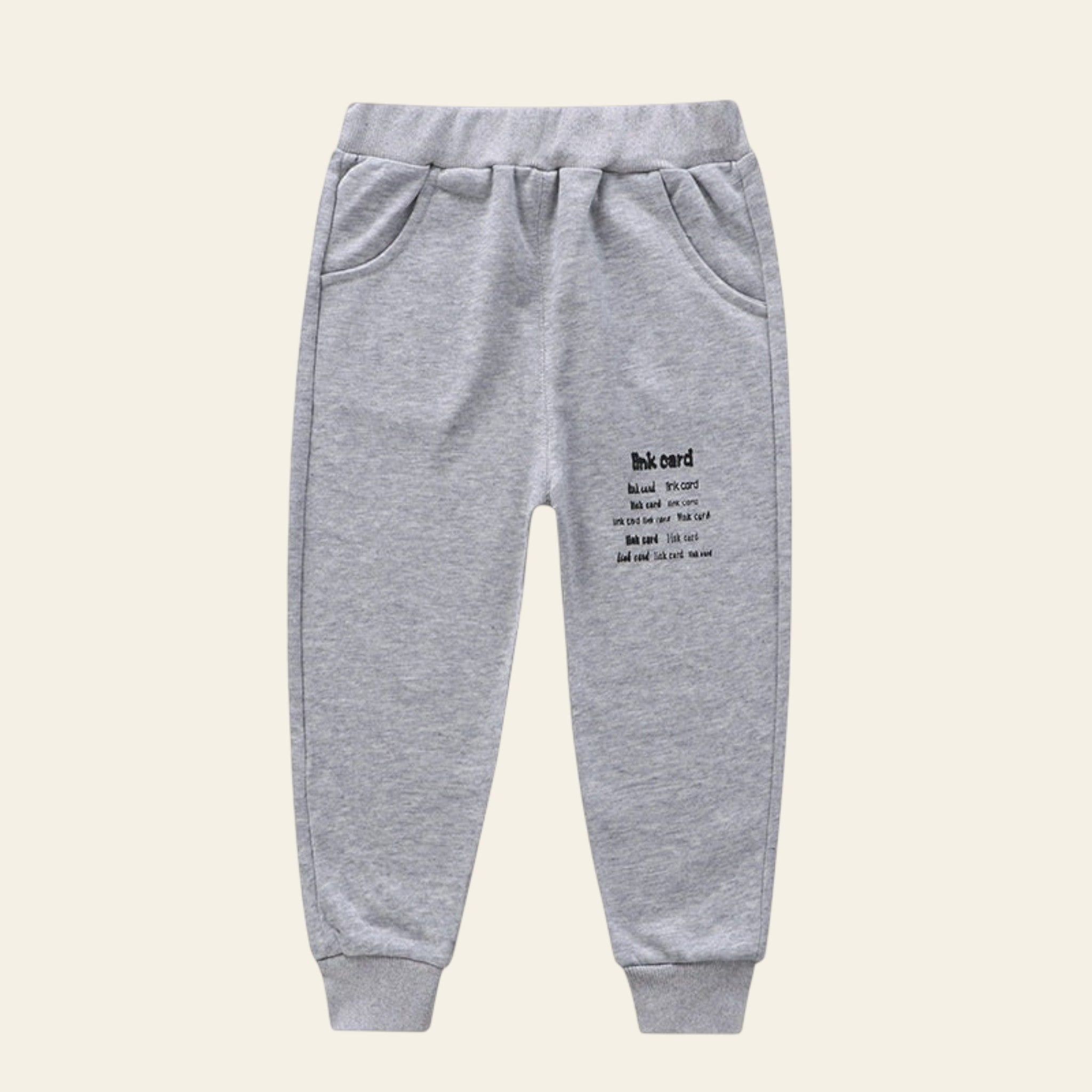 Gray sweatpants with text on a white background