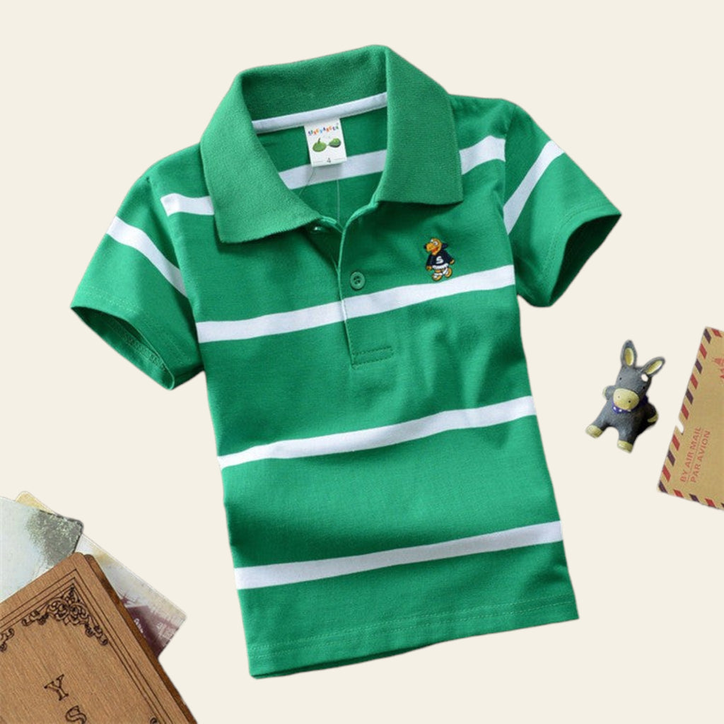 Green polo shirt with white stripes on a gray surface