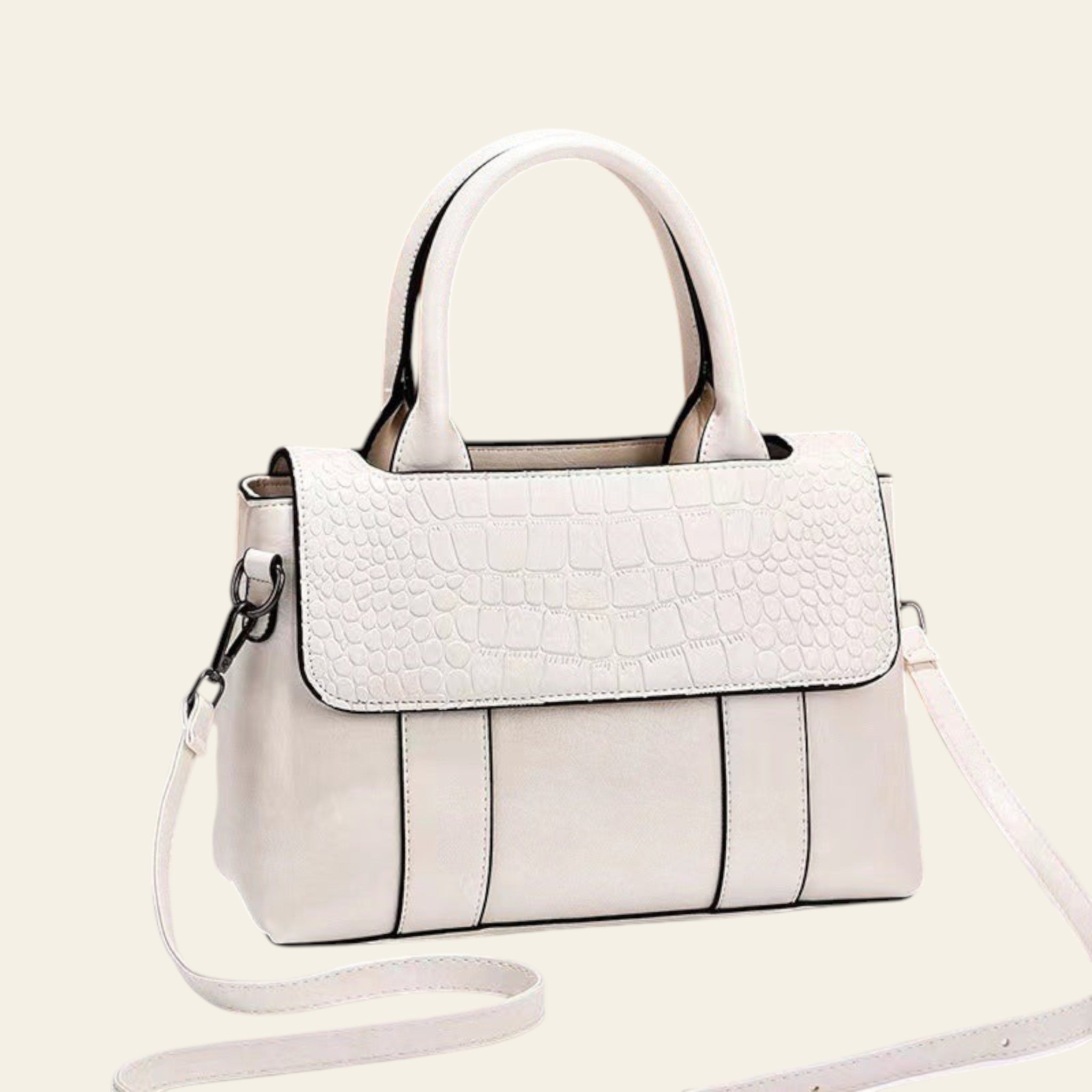 White handbag with a textured pattern on a white surface with a brown background