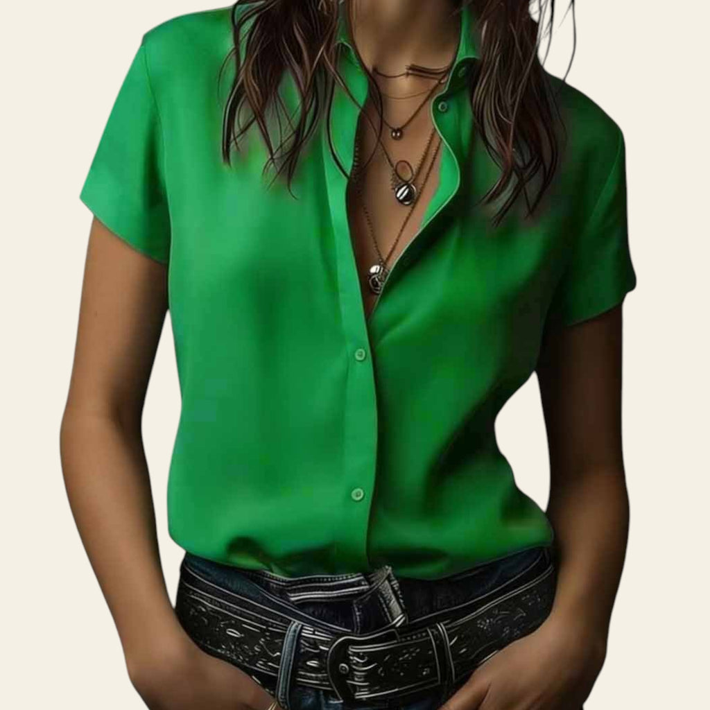Person wearing a green shirt with a dark background
