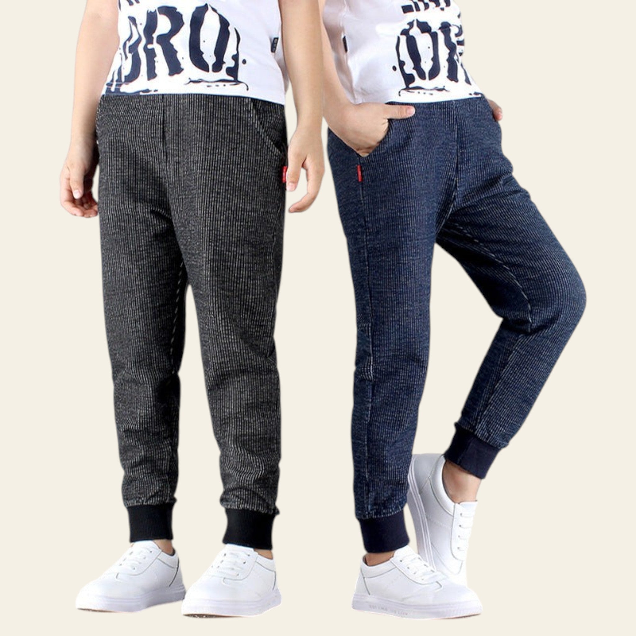 Two people wearing checkered pants and white sneakers on a plain background