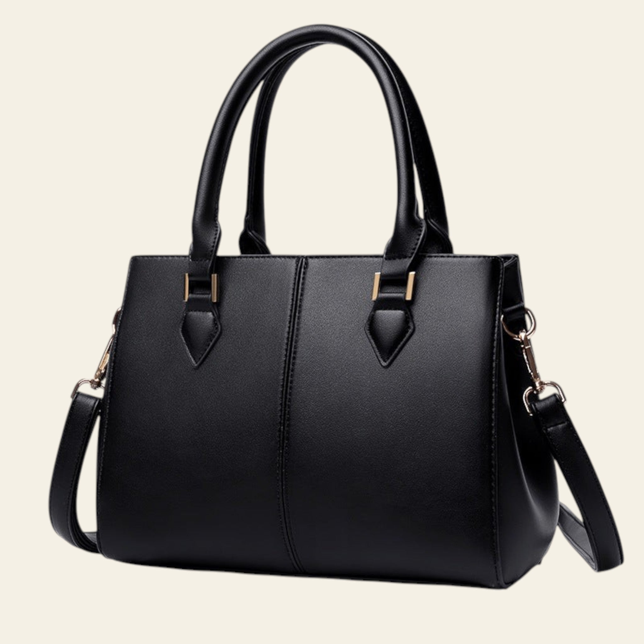 Black handbag with gold accents on a white background