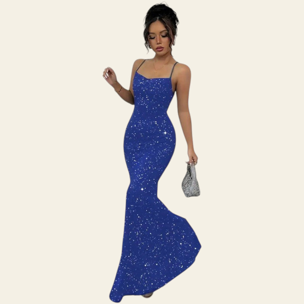 Woman wearing a blue backless sequin maxi slip dress