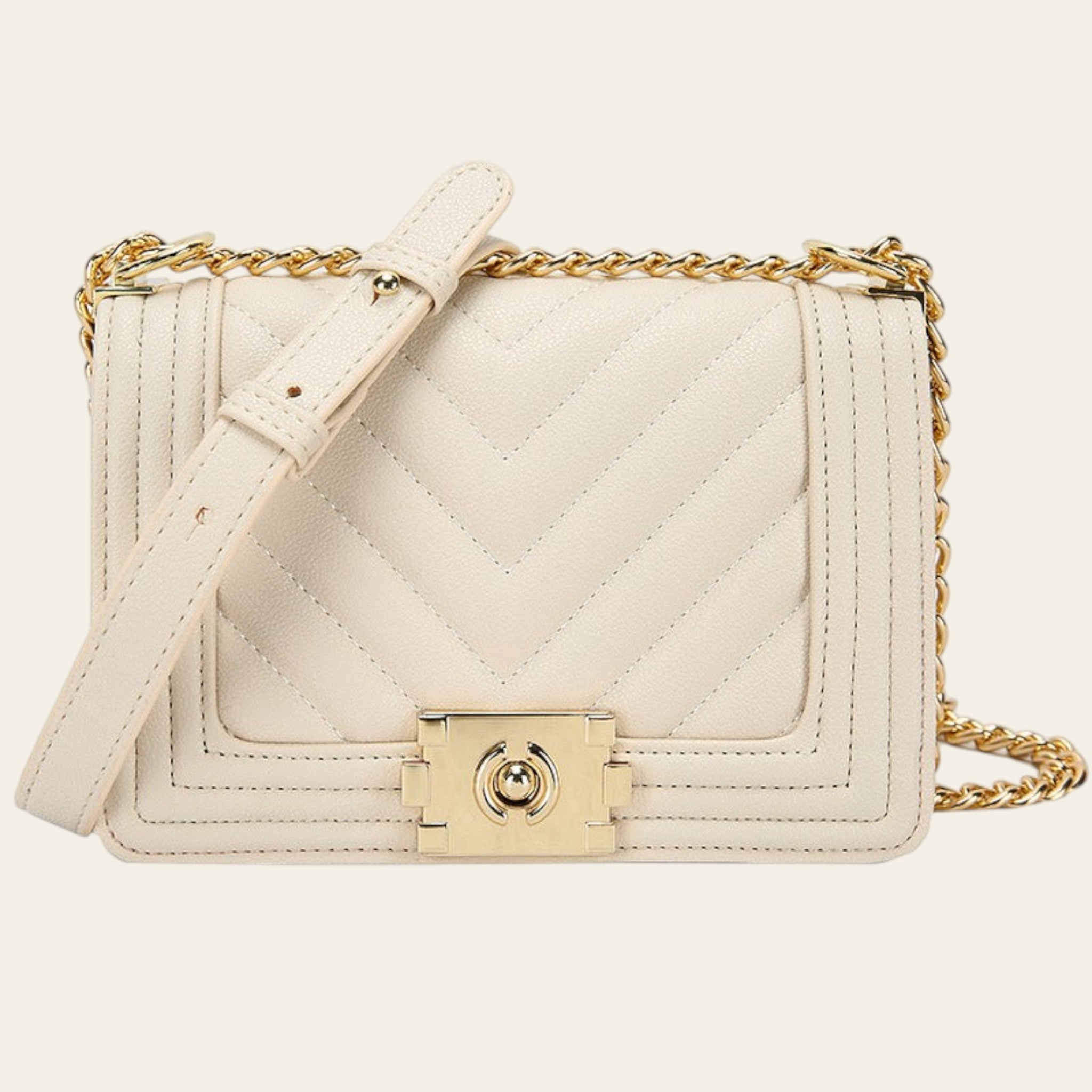 White quilted handbag with gold chain and clasp on a white background
