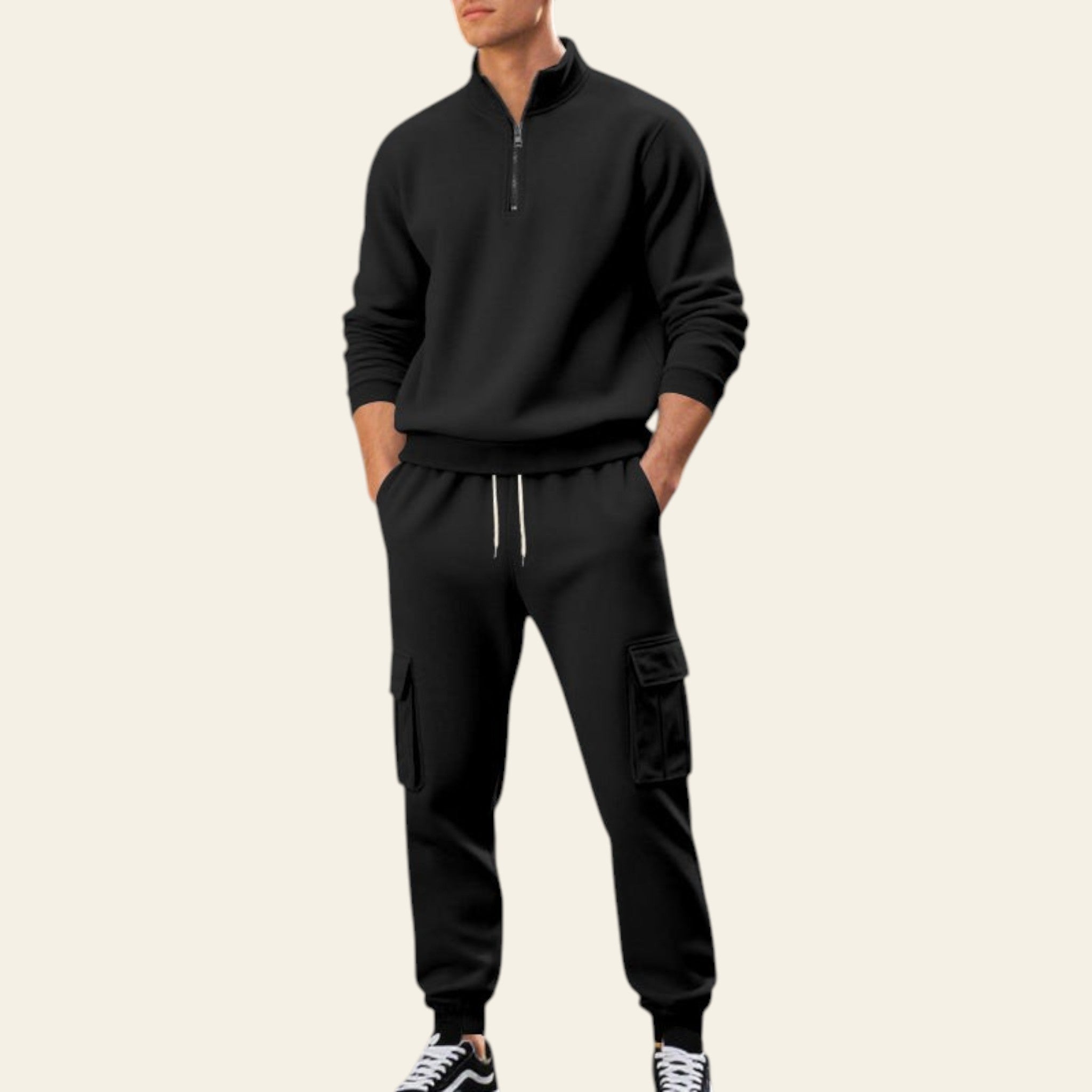 Man wearing a black fleece-lined tracksuit set with zip-up jacket and jogger pants on a city street