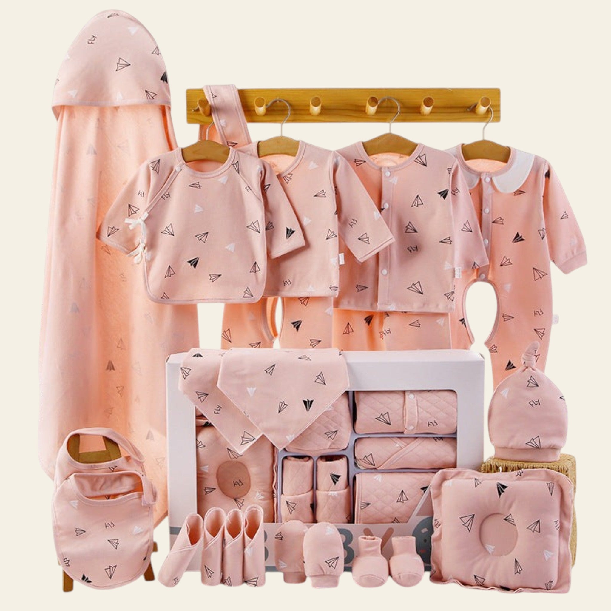 Baby clothing set with pink designs on a white background